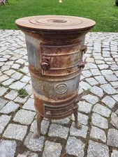 alter antiker Holzofen um